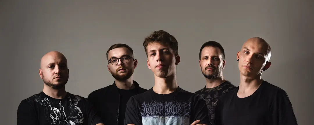 Studio portrait of the five Enslave Them Stars members against a light backdrop.